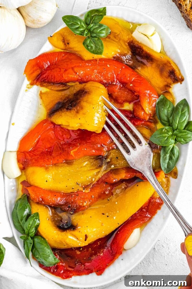roasted bell peppers with a fork