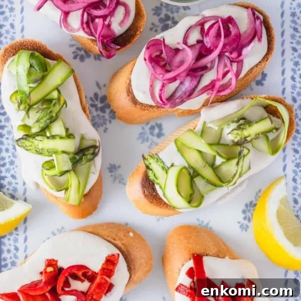 crostini recipe with colorful toppings and lemon wedges