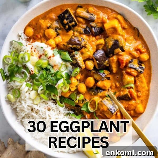 Creamy eggplant curry recipe served with basmati rice, fresh herbs, and a wedge of lime.