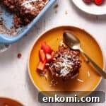 German chocolate cake baked oatmeal in a baking dish with a couple servings on small plates.