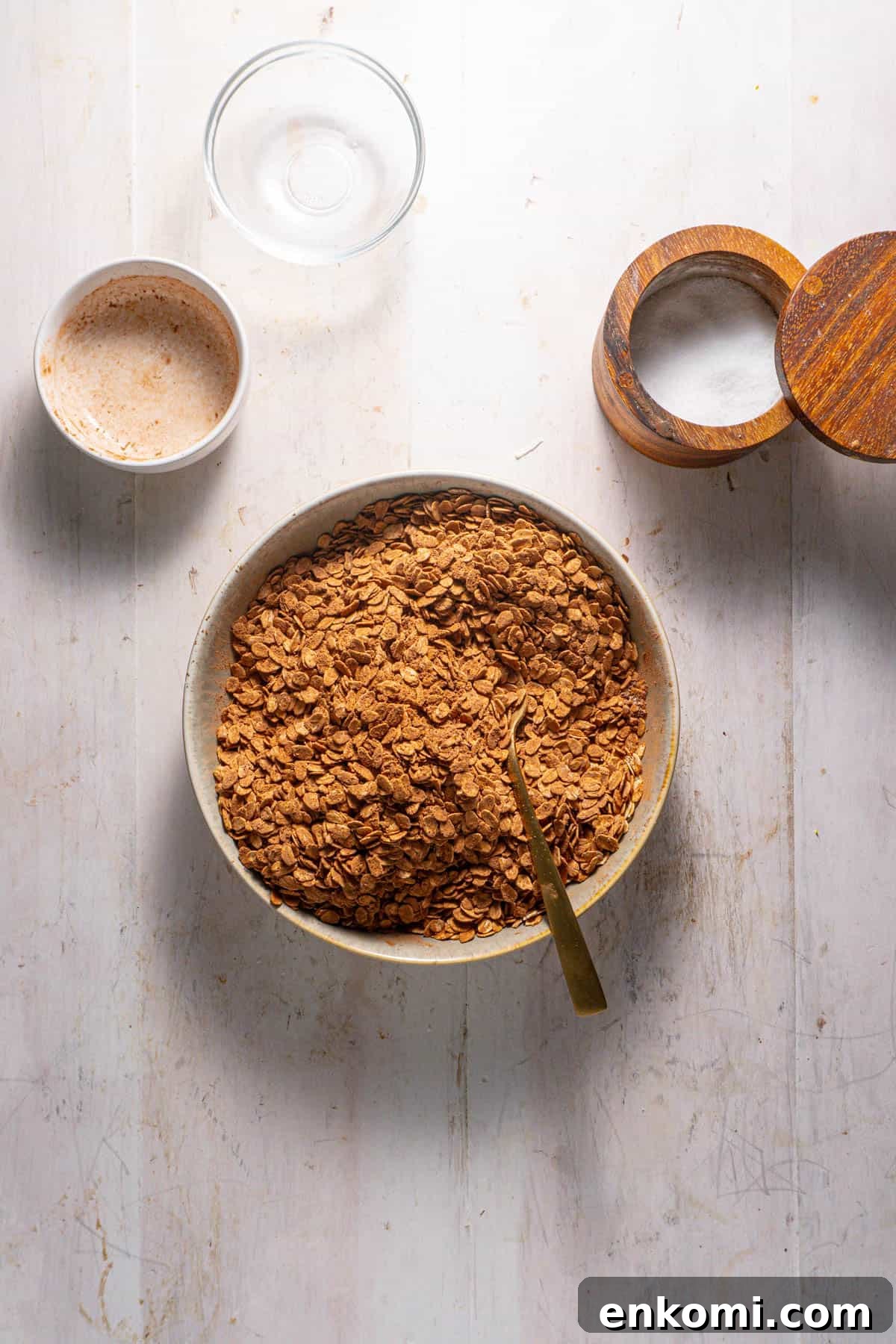 German Chocolate Cake Baked Oatmeal Recipe for Decadent Mornings 4 Oats and cocoa powder mixing together in a bowl for a german chocolates baked oatmeal.