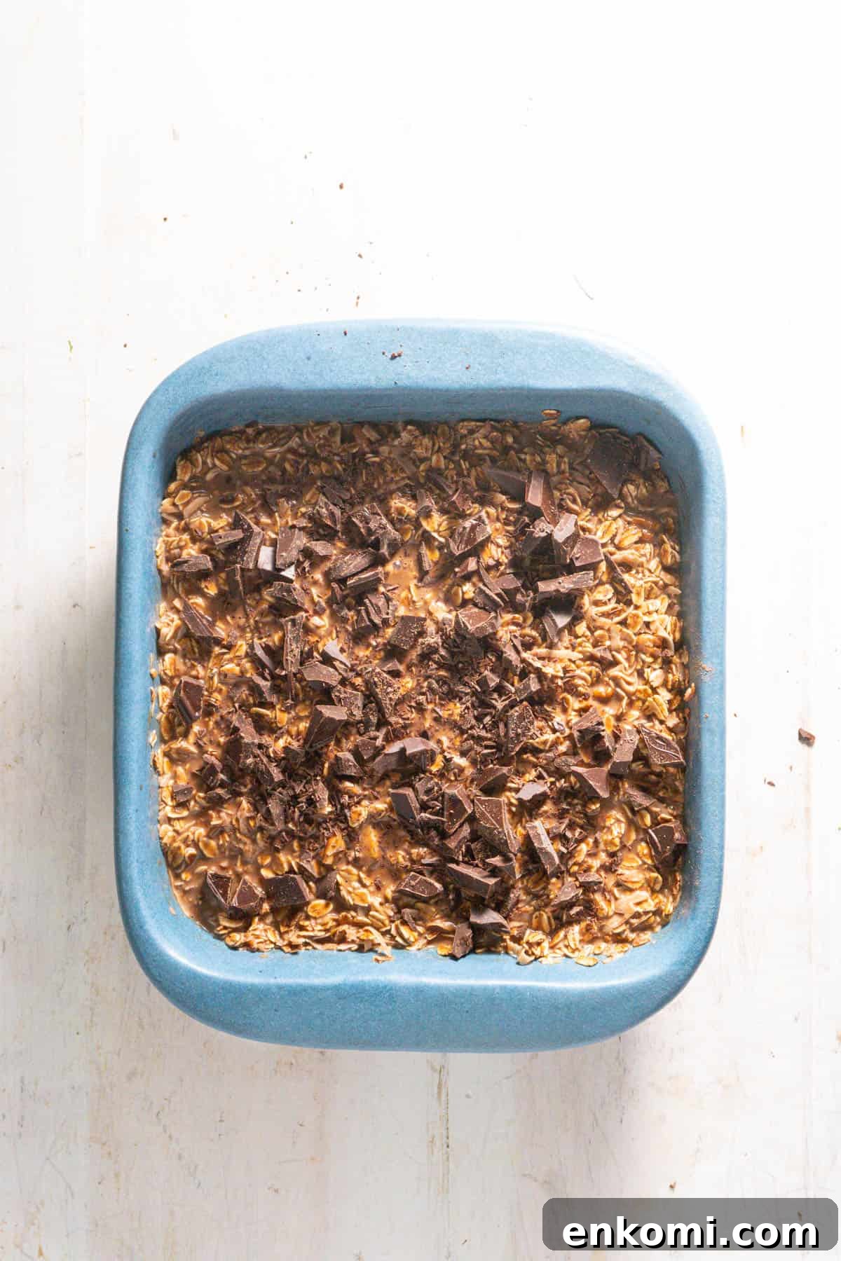 German Chocolate Cake Baked Oatmeal Recipe for Decadent Mornings 7 A german chocolate caked topped with chopped chocolate ready to get baked.