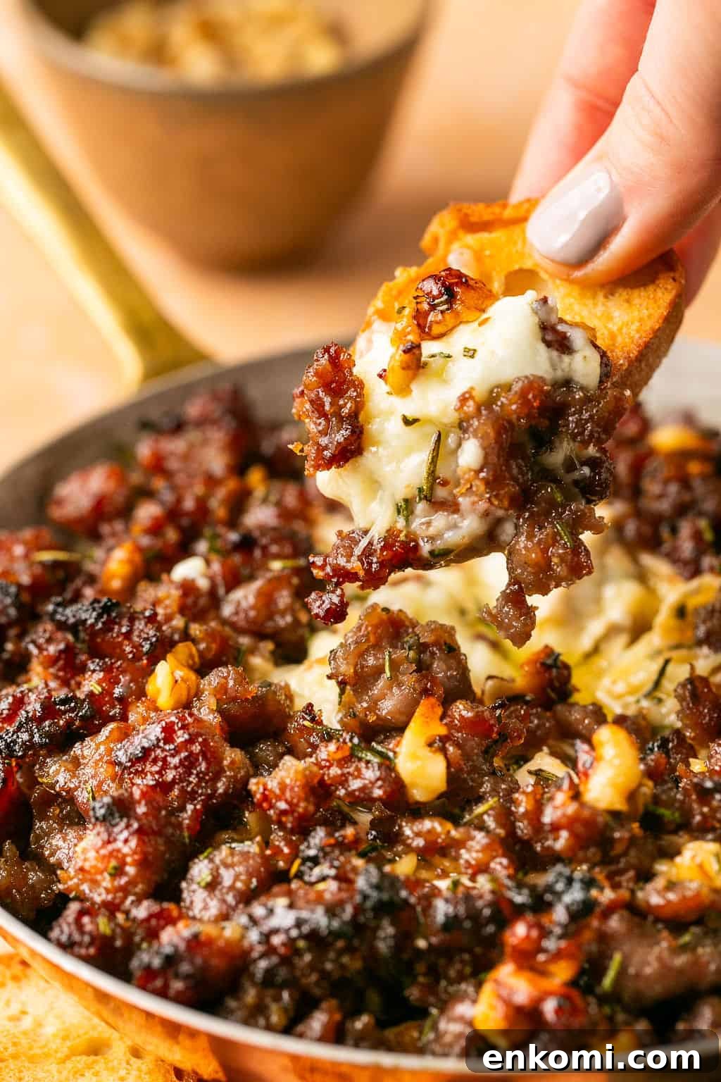 Baked Brie with Sausage and Honey Glaze 2 dipping crostini into sausage baked brie