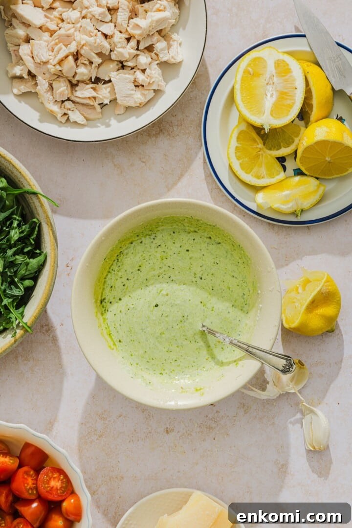 Creamy pesto dressing in a small bowl.