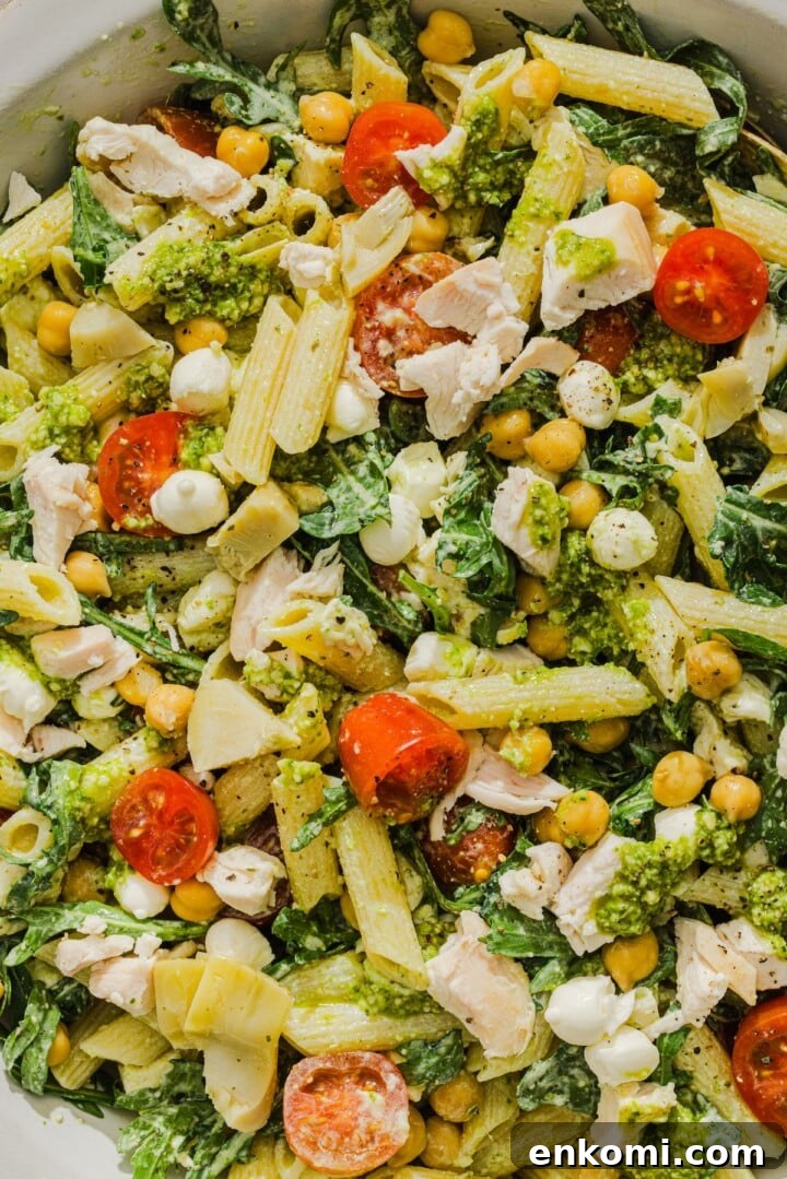 Close-up of pesto chicken pasta salad.