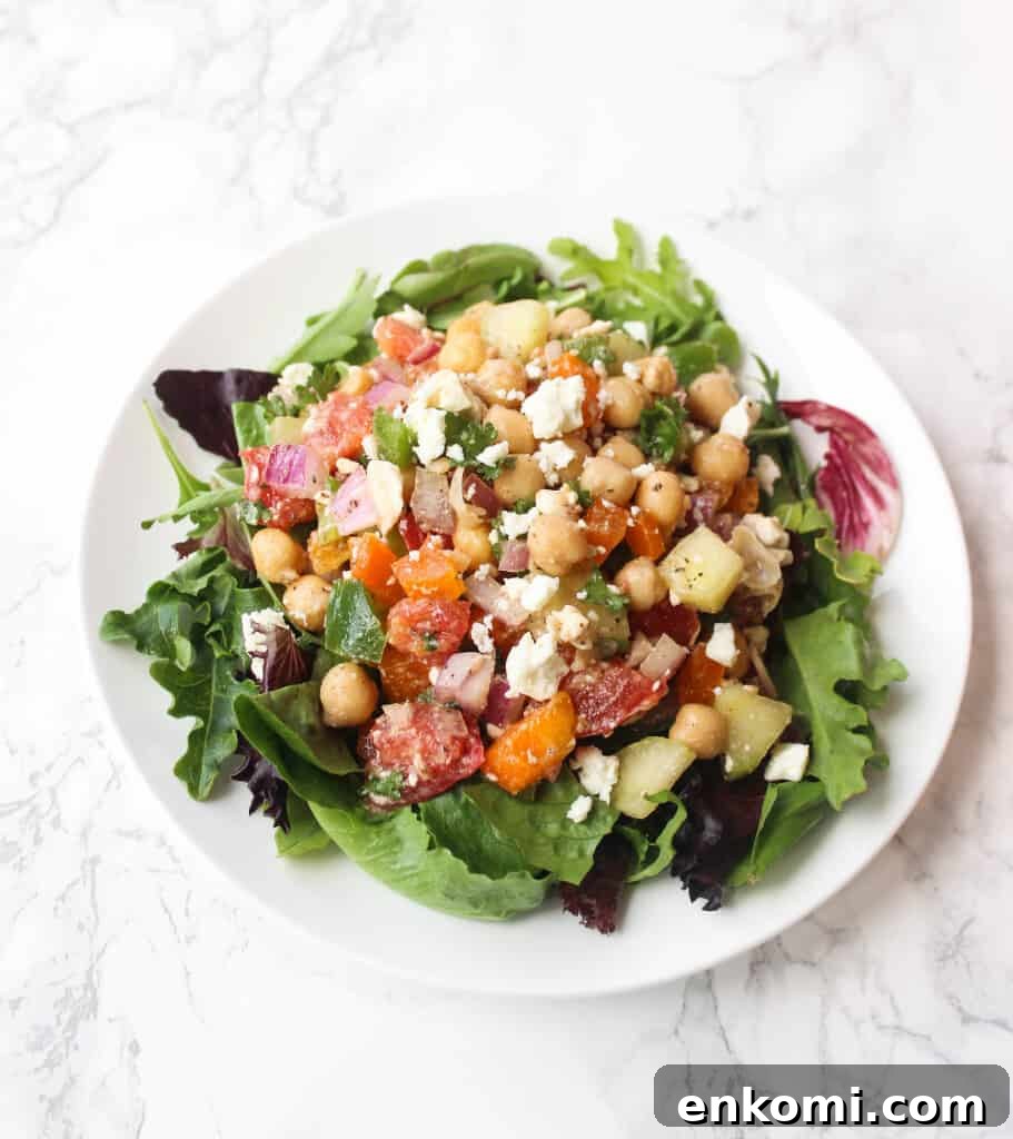 Loaded Greek Chickpea Salad Recipe for Mediterranean Flavor 2 Greek Chickpea Salad LOADED with toppings - it's a simple and healthy meal to whip up! | www.healthy-liv.com