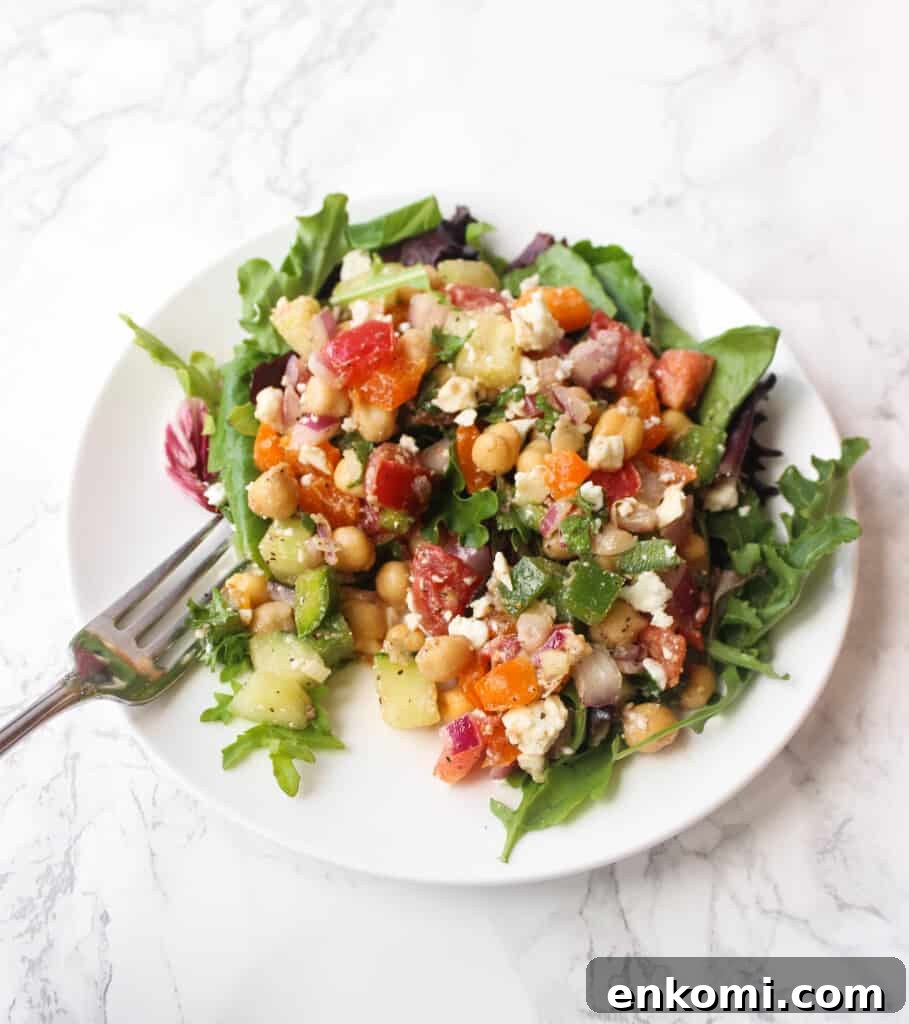 Loaded Greek Chickpea Salad Recipe for Mediterranean Flavor 3 Greek Chickpea Salad LOADED with toppings - it's a simple and healthy meal to whip up! | www.healthy-liv.com