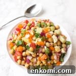Greek Chickpea Salad LOADED with toppings - it's a simple and healthy meal to whip up! | www.healthy-liv.com