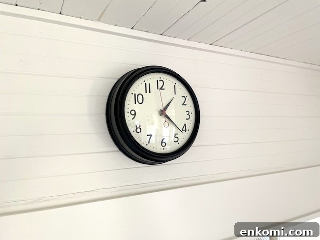retro wall clock on beadboard wall