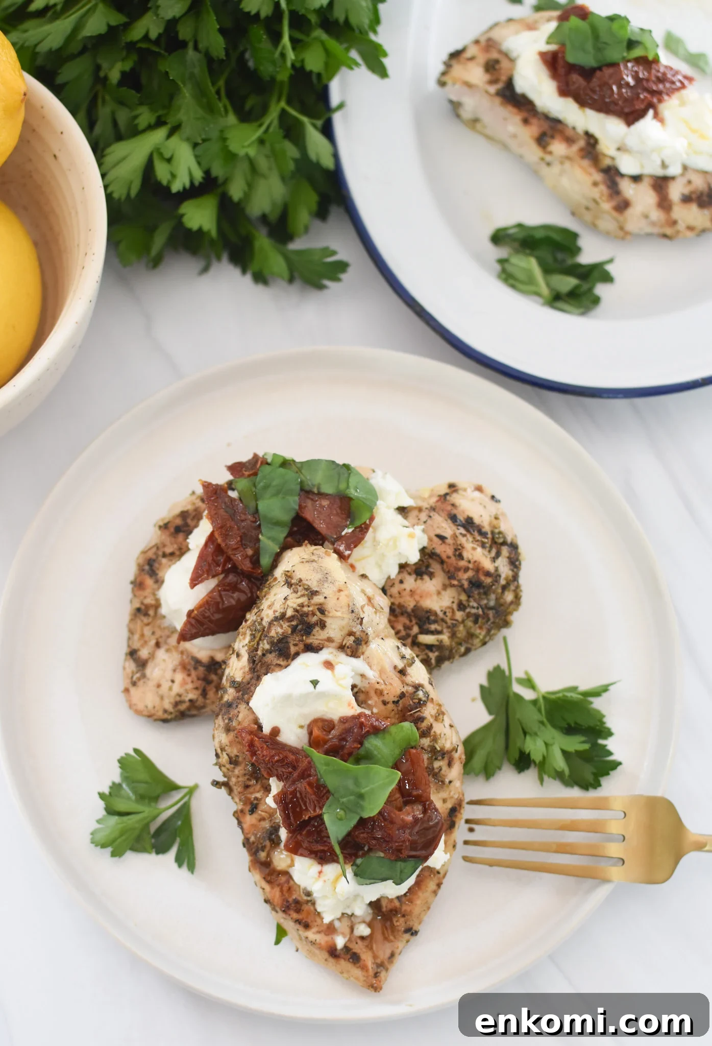 Chicken Bryan on plate with fork. 