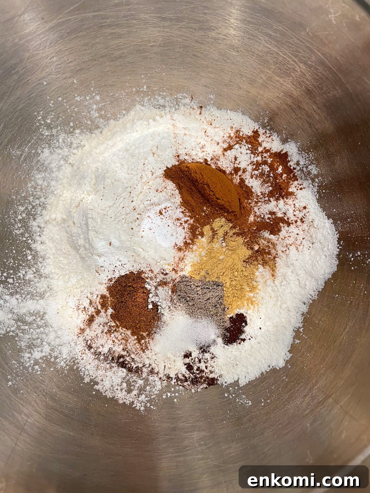 overhead shot of dry cake ingredients in mixing bowl.