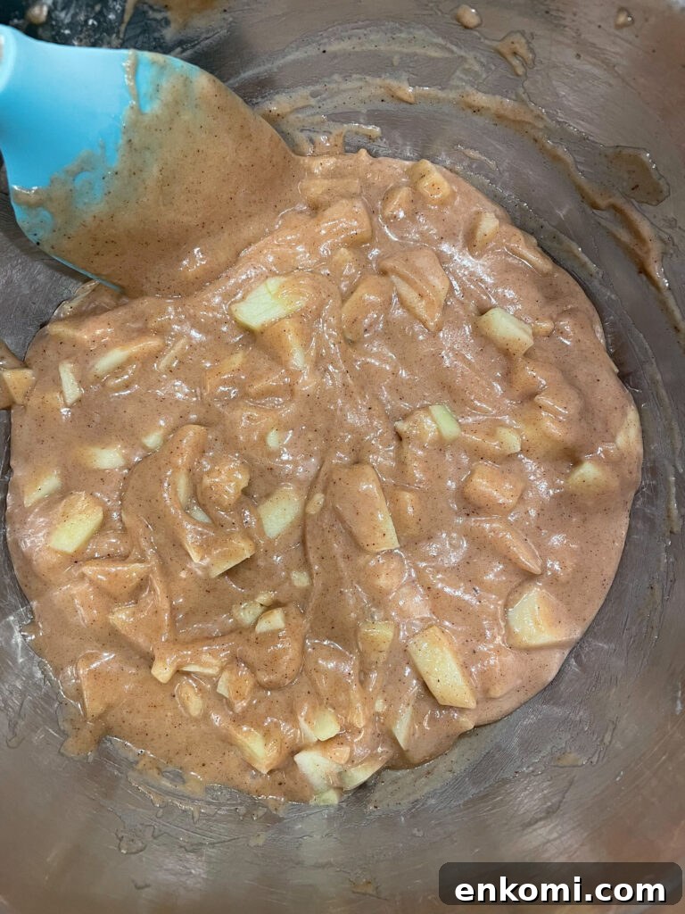 cake batter with apples mixed in