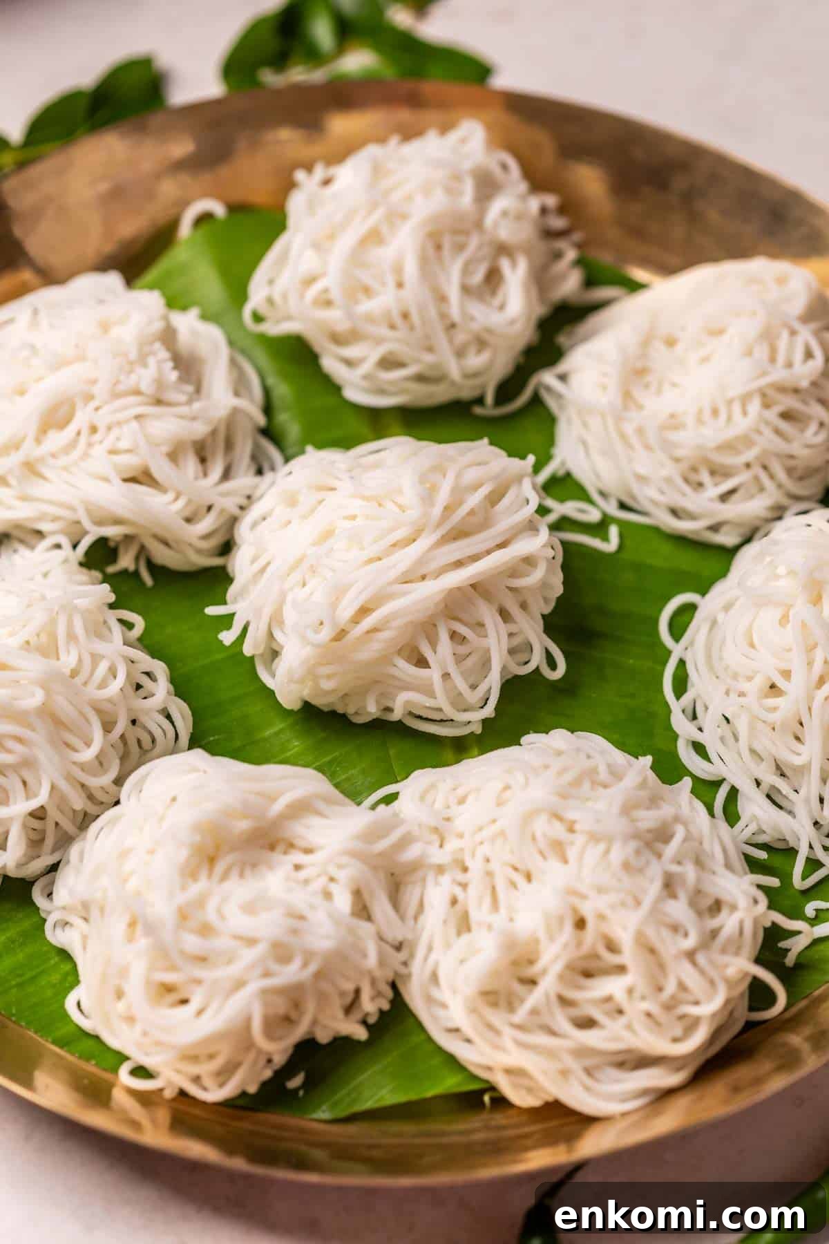 Rice idiyappams served on banana leaf in a plate