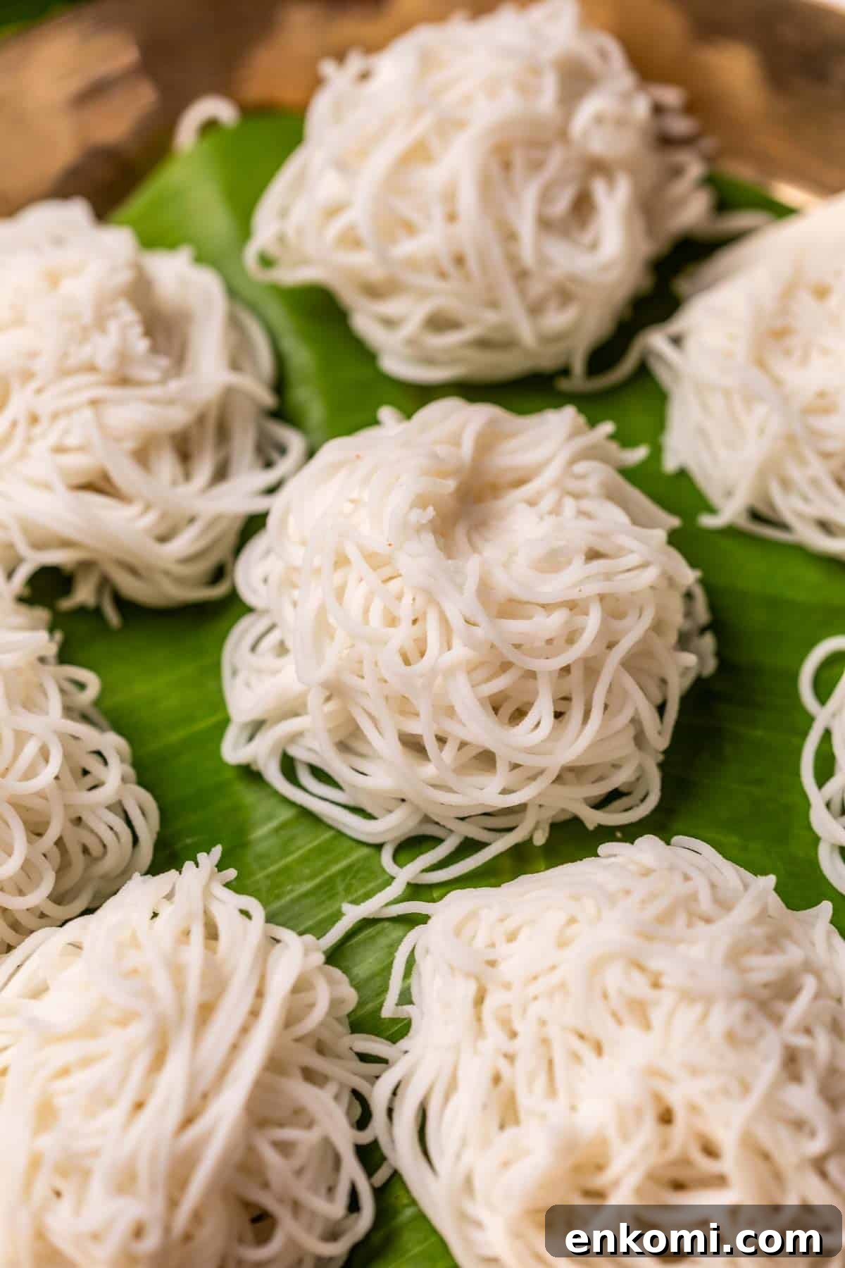 Rice idiyappams served on banana leaf in a plate