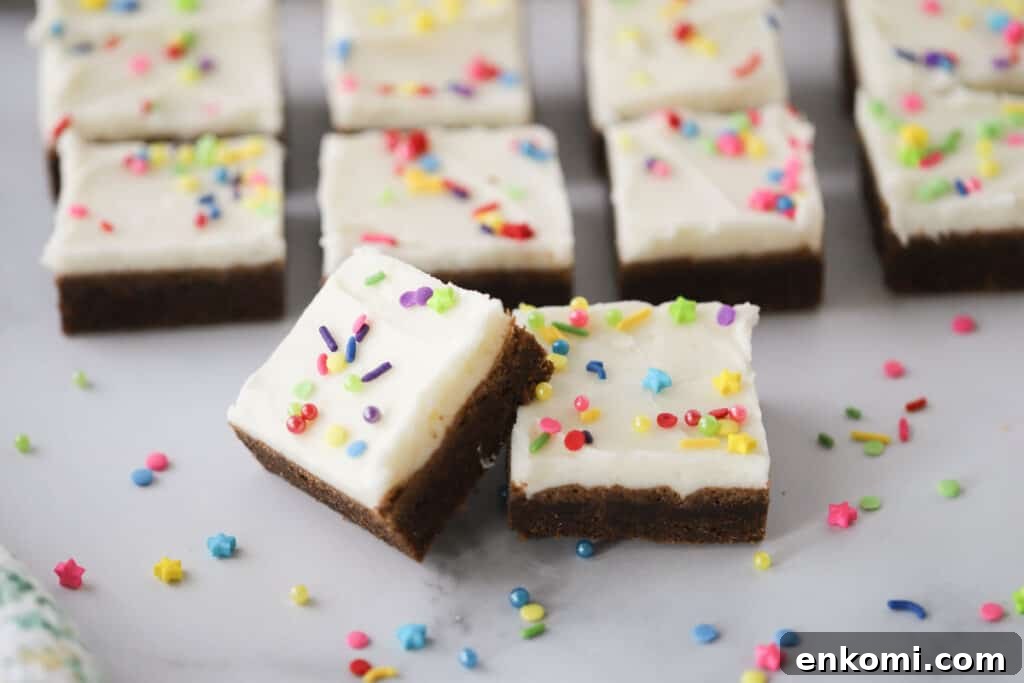 Chewy chocolate sugar cookie bars frosted with vanilla buttercream, chocolate cookie squares.