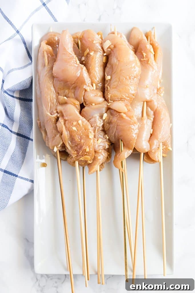 Chicken skewers on a white plate