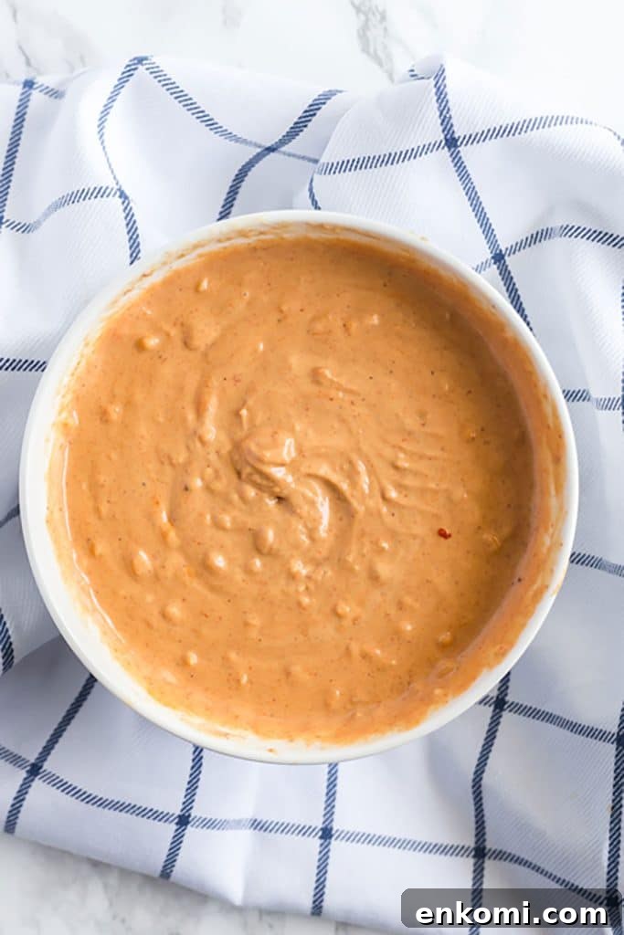 thai peanut sauce in a white bowl