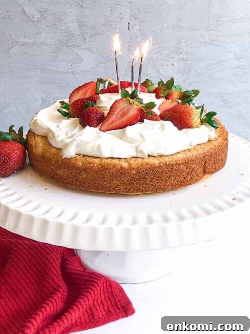 A gluten free lemon vanilla cake with strawberries and cream