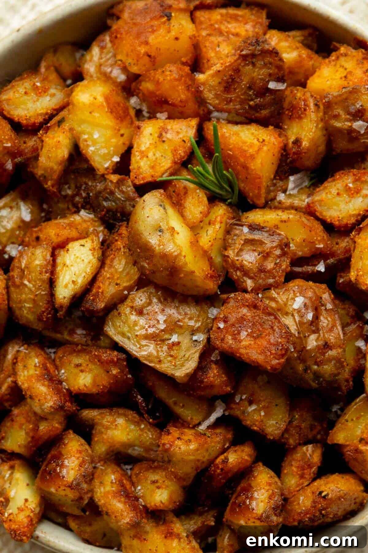 Crispy oven roasted potatoes recipe with golden Yukon gold potatoes and rosemary.