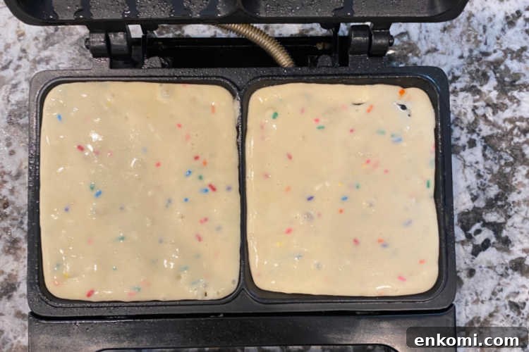 Homemade Funfetti Waffles Recipe for Soft, Colorful Breakfast 4 funfetti waffle batter in waffle iron