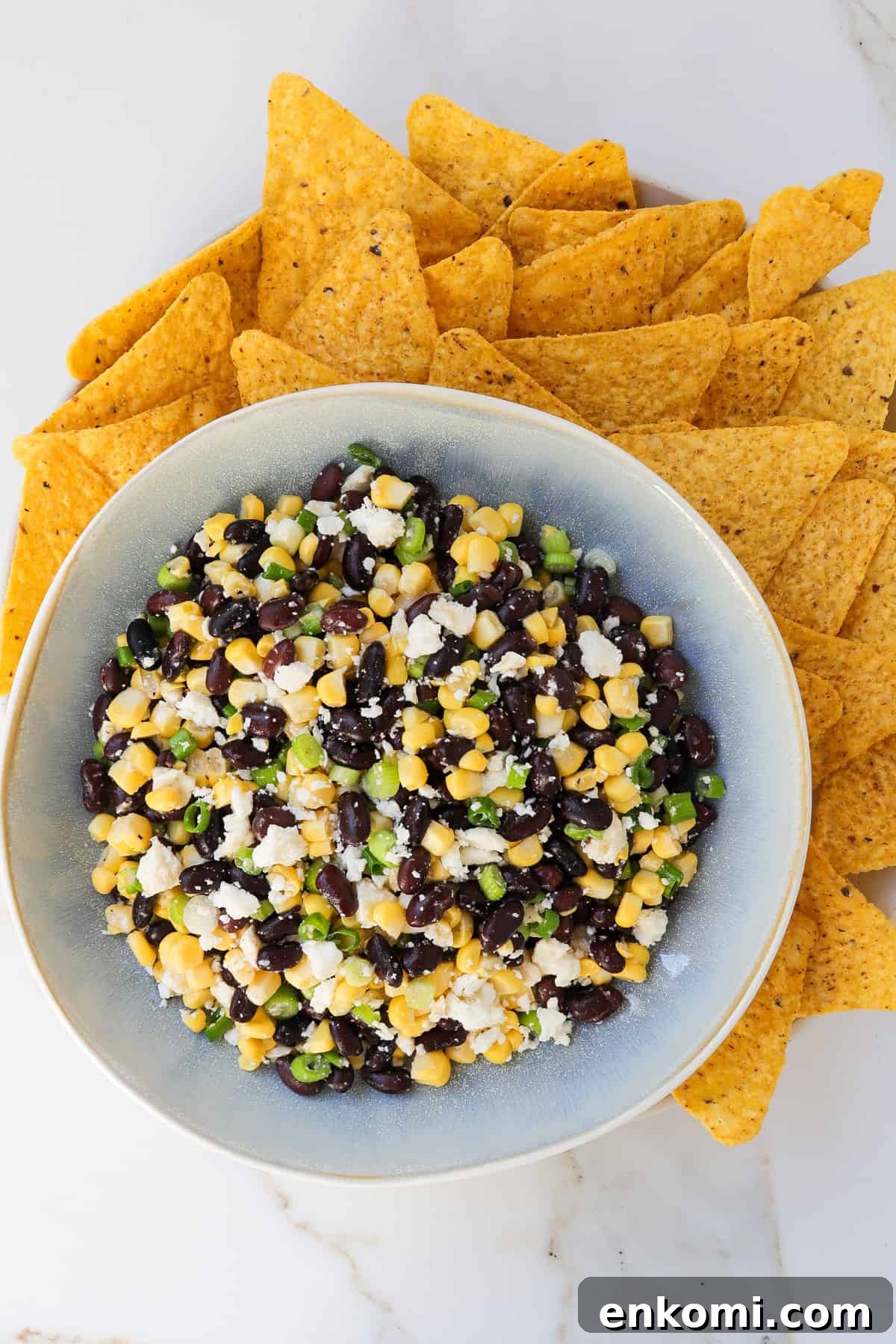 Black bean corn feta dip with tortilla chips.