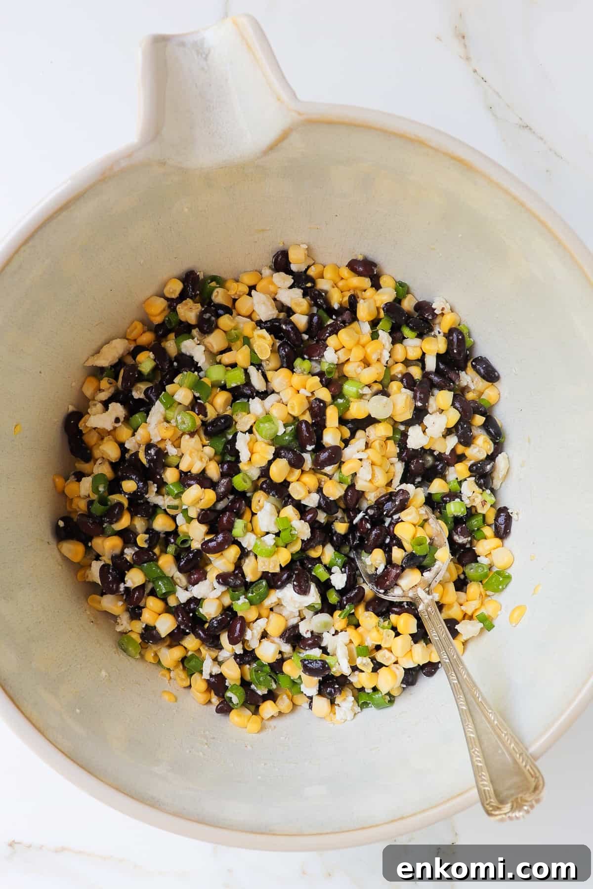Black bean corn feta dip in a large mixing bowl.