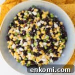 Black bean corn feta dip with tortilla chips.