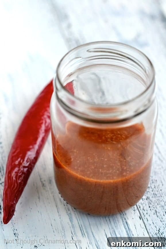 Thai Salmon Salad with Tangy Sweet Chili Dressing 3 Thai Sweet Chili Sauce Dressing in a mason jar with a red chili on the side