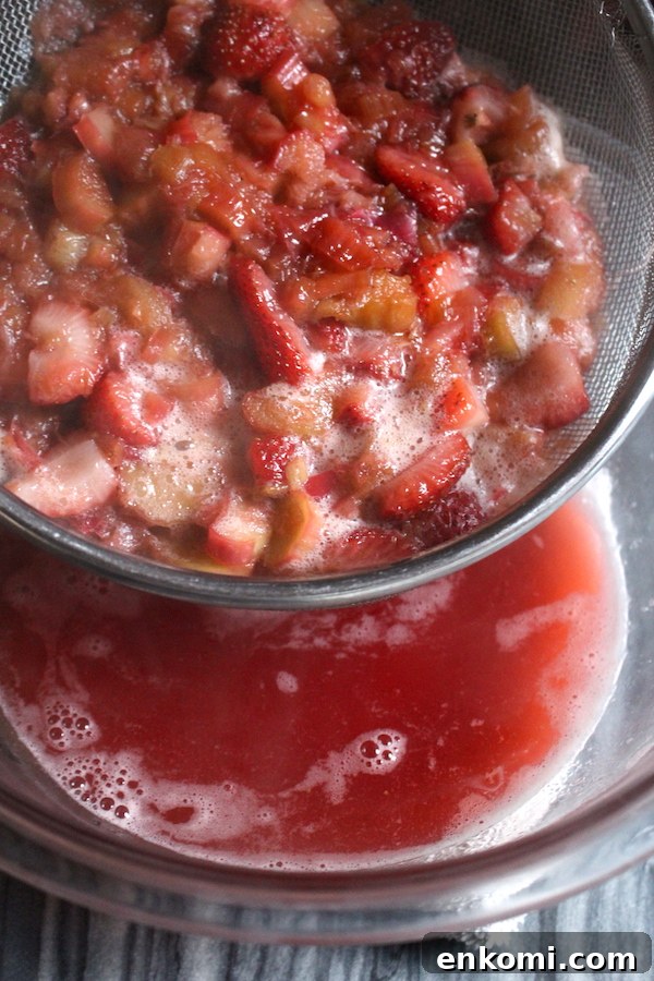 Homemade Strawberry Rhubarb Jam Recipe for Preserving Fresh Fruit 6 Straining the juice out of strawberry rhubarb jam so that it can cook separately. This will allow the jam to thicken fully without pectin.