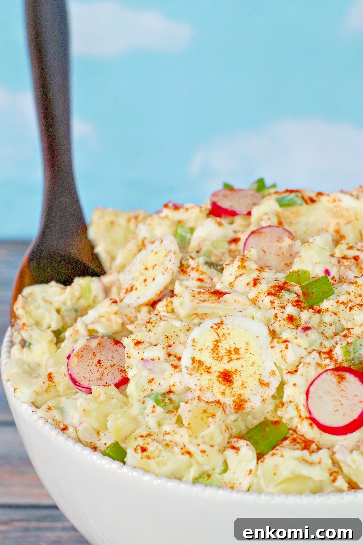 Weight Watchers Potato Salad Recipe — Light & Flavorful 12 Potato salad in white bowl with brown serving spoon