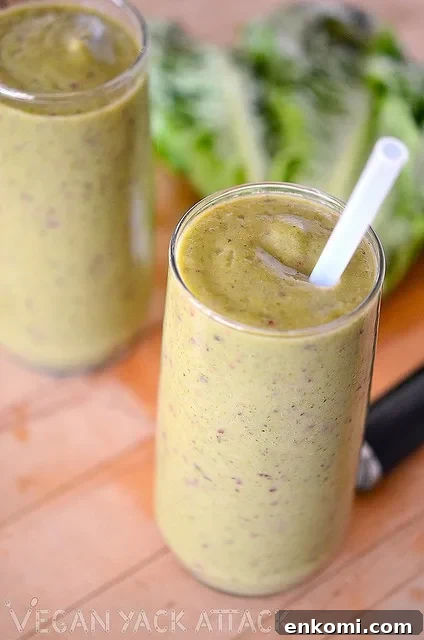 Grape Green Smoothie in two glasses with a straw
