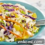 close up of pineapple slaw on a blue plate
