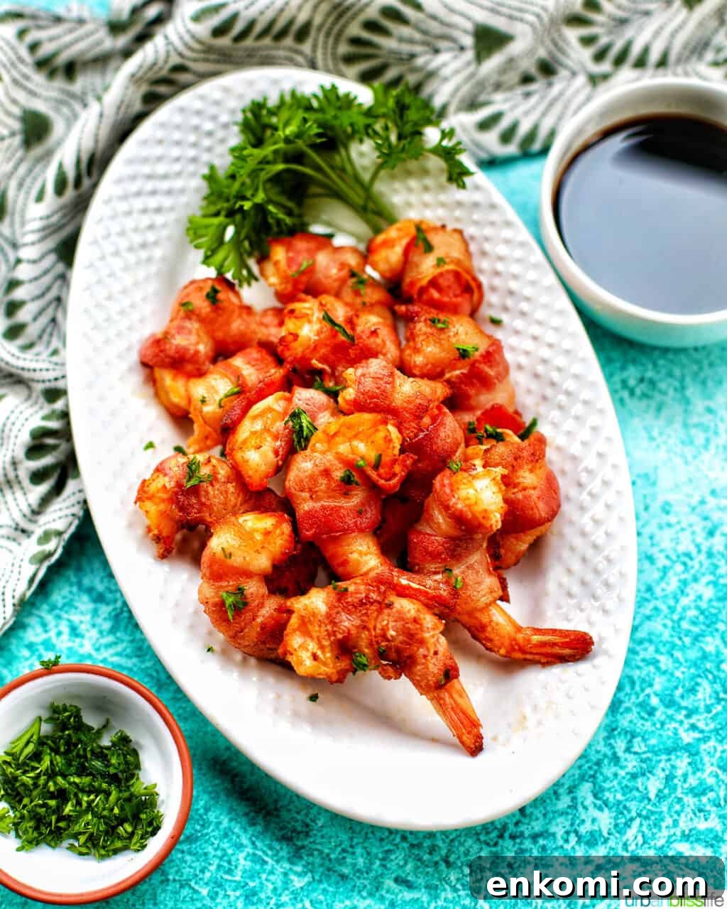 Crispy Air Fryer Bacon-Wrapped Shrimp Recipe 11 air fryer bacon wrapped shrimp on a white plate