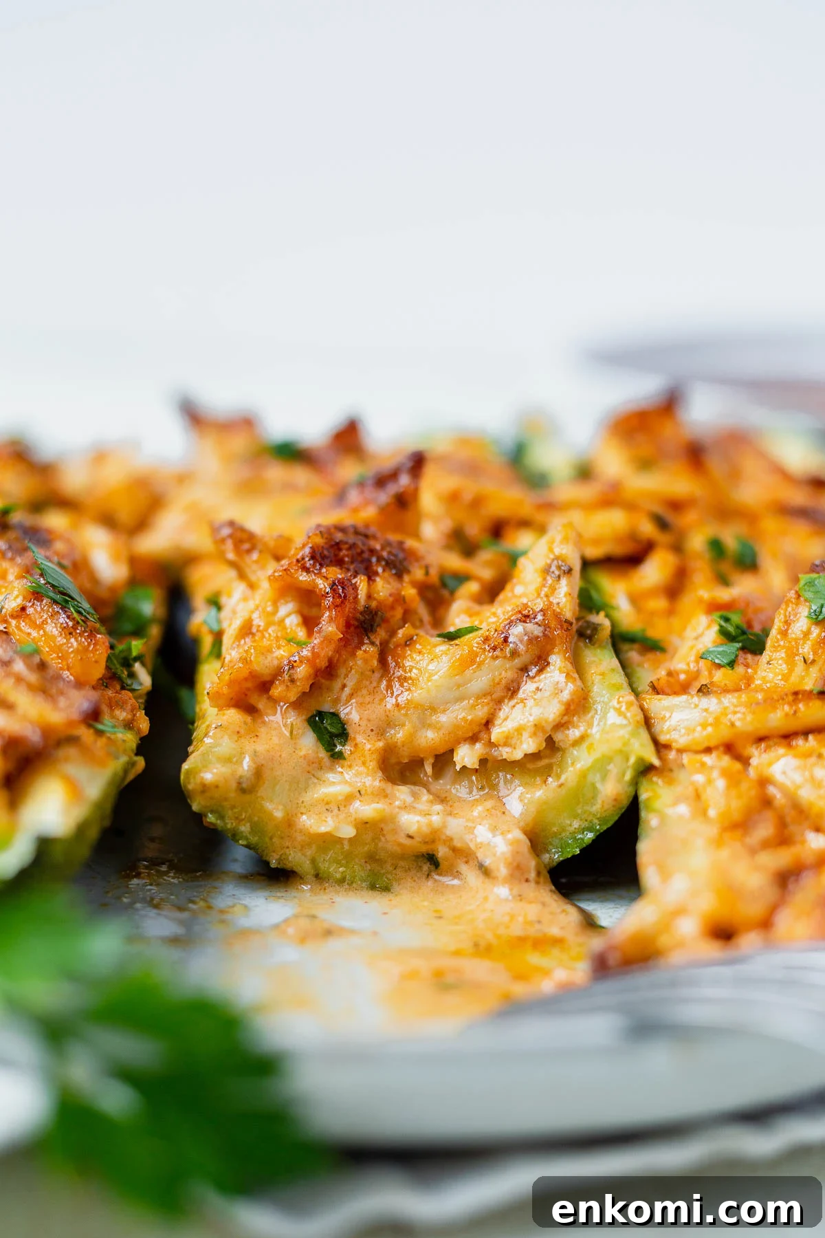 buffalo chicken zucchini boat cut in half