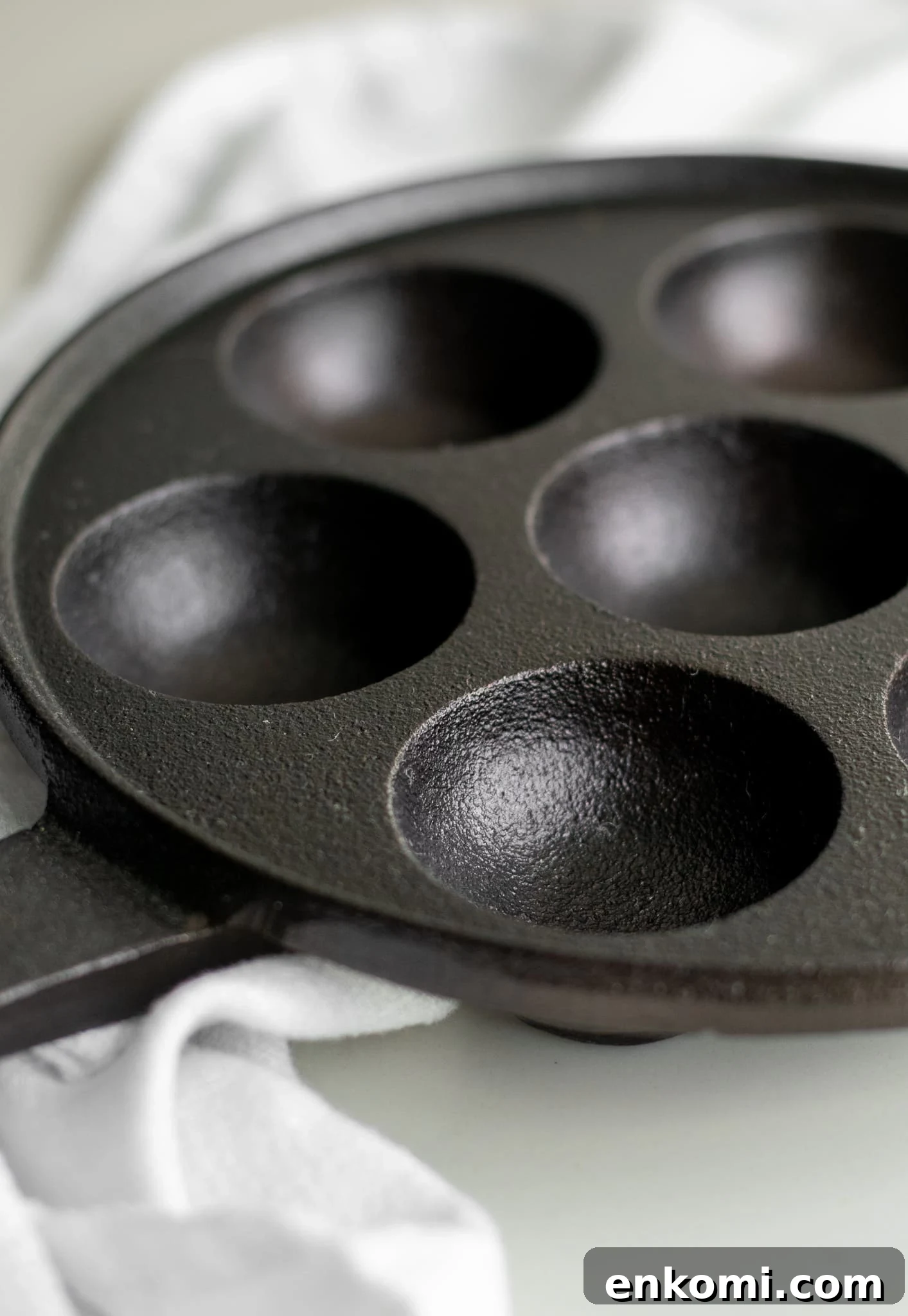 A pan for making danish aebleskiver.