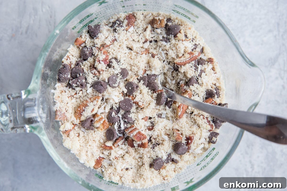 Dry ingredients for cowboy cookies in a mixing bowl.