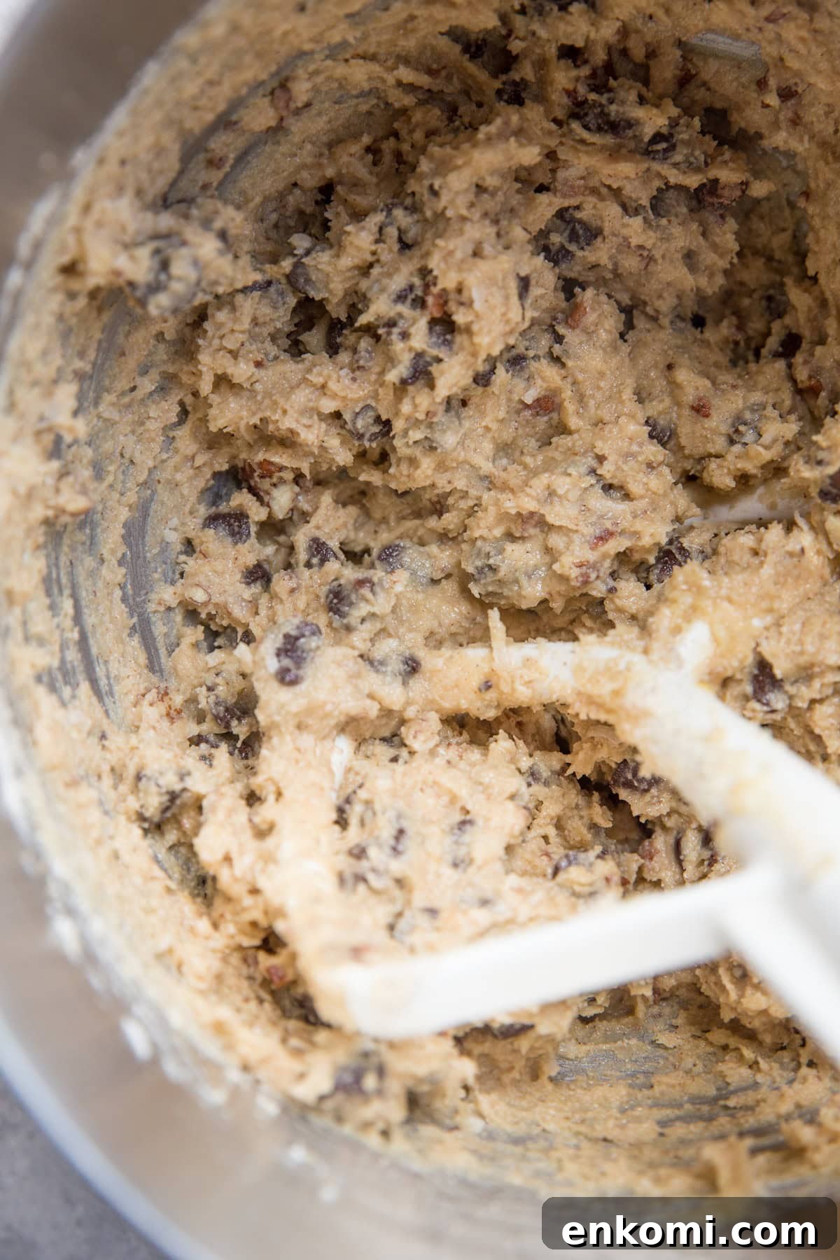 Cowboy cookie dough in a mixing bowl, ready to be baked.