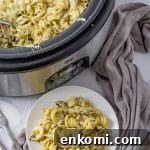 Slow Cooker Pesto Chicken Recipe for Tender, Flavorful Meals 6 twisted pasta in a pesto sauce with shredded chicken and melted mozzarella