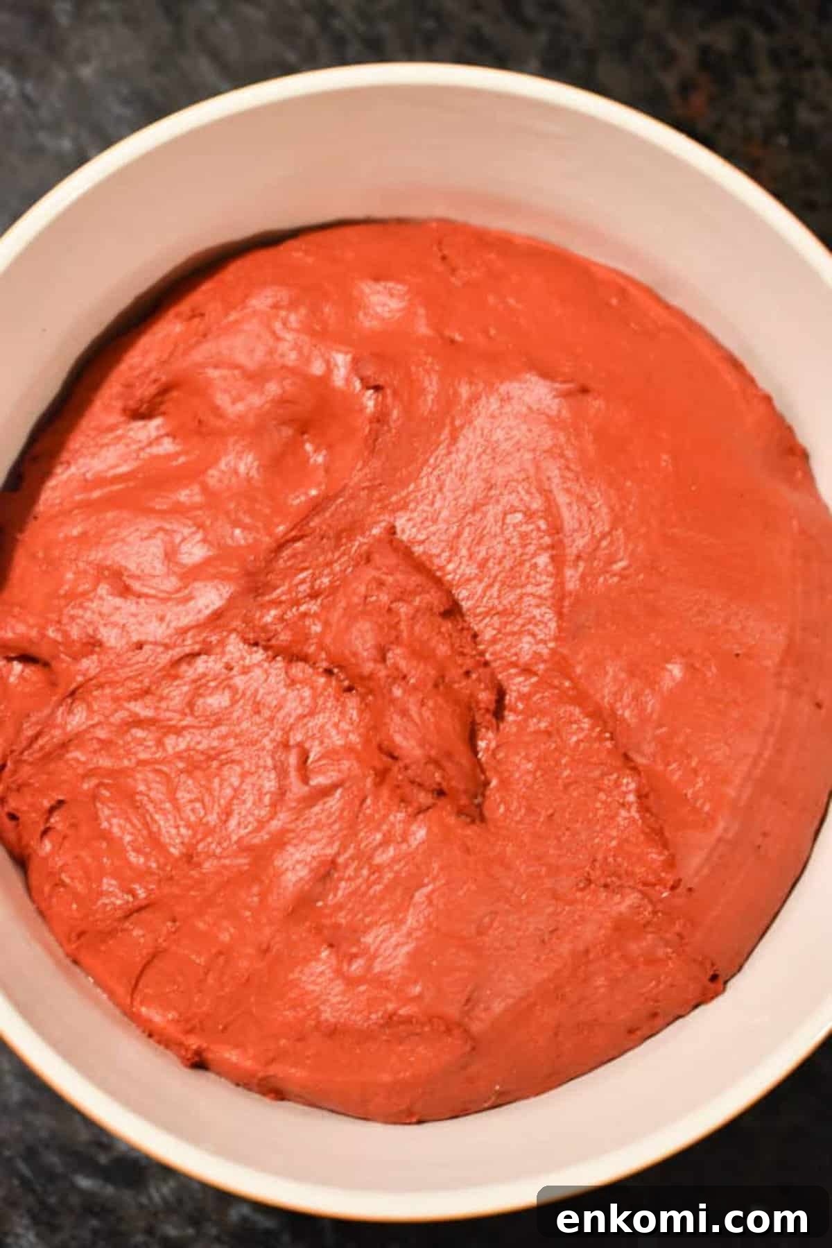 Homemade Red Velvet Cinnamon Rolls with Cream Cheese Glaze 4 The dough has doubled in size in a large bowl.