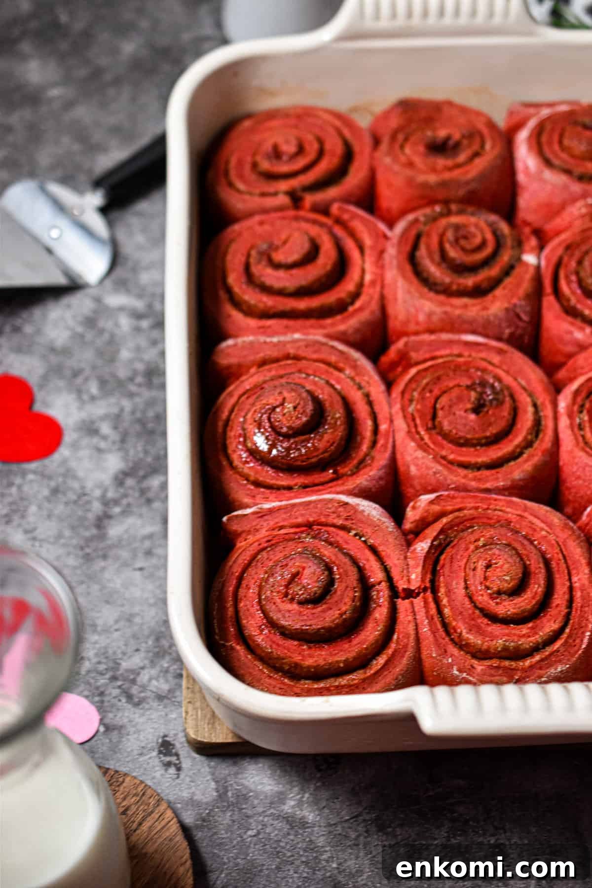 Homemade Red Velvet Cinnamon Rolls with Cream Cheese Glaze 7 The cinnamon buns are baked and ready for the icing.