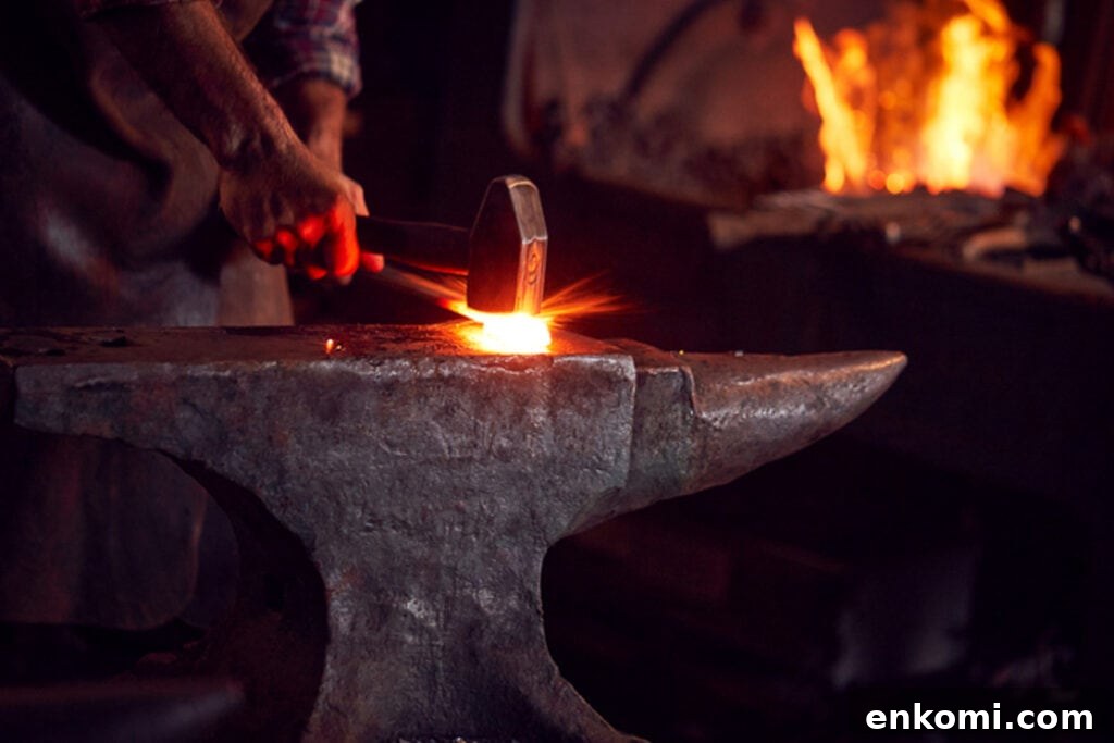 A blacksmith is working on a blacksmith's anvil.