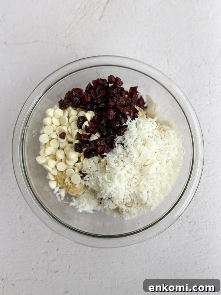 White Chocolate, Cranberry & Orange Cookies — Holiday Citrus Treats 9 adding in the white chocolate, cranberries and coconut.