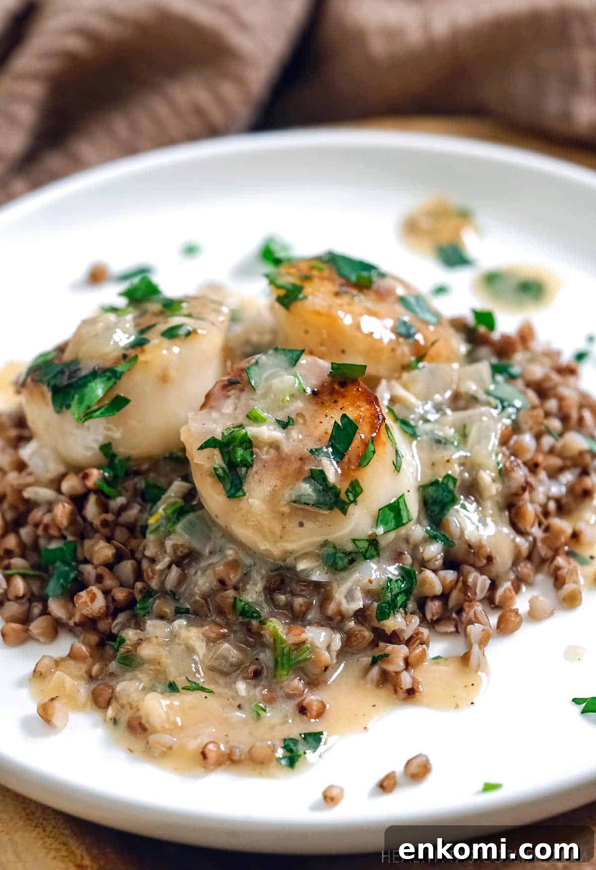 Dairy-Free Creamy Scallops Recipe (Whole30 Friendly) 8 Gluten free scallops dinner: pan seared scallops with dairy free white sauce served over buckwheat.