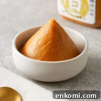 Miso Substitutes and Alternatives: What to Use — and What to Avoid 10 A pyramid of white miso paste in a small white bowl.