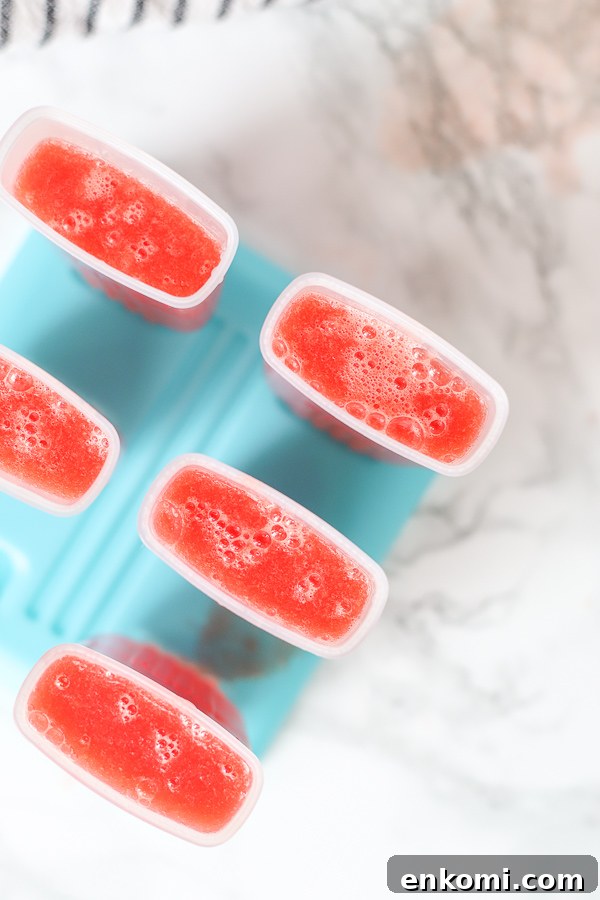 watermelon mixture poured into a popsicle mold
