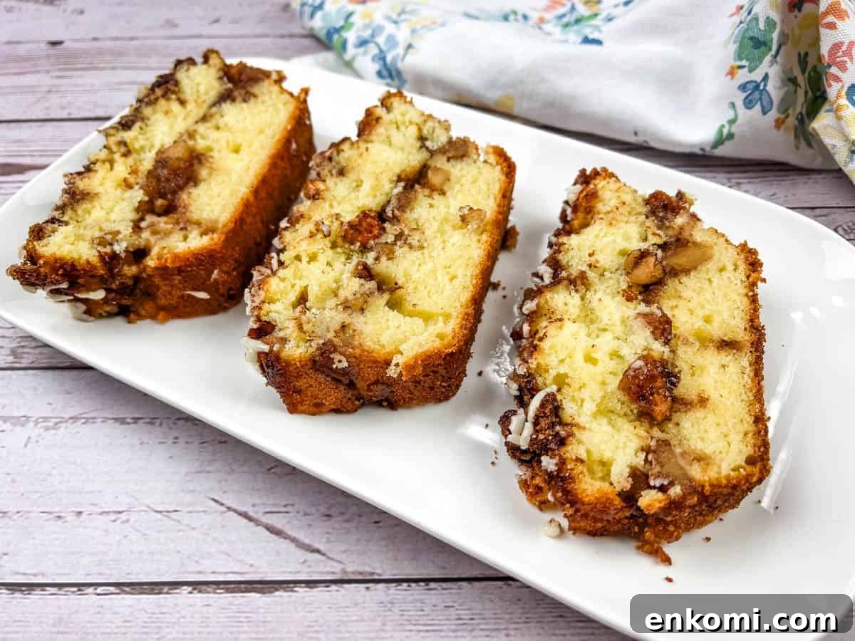 29 Fall Desserts That Bring Generations of Flavor Together 26 Three slices of apple fritter bread on a white plate.