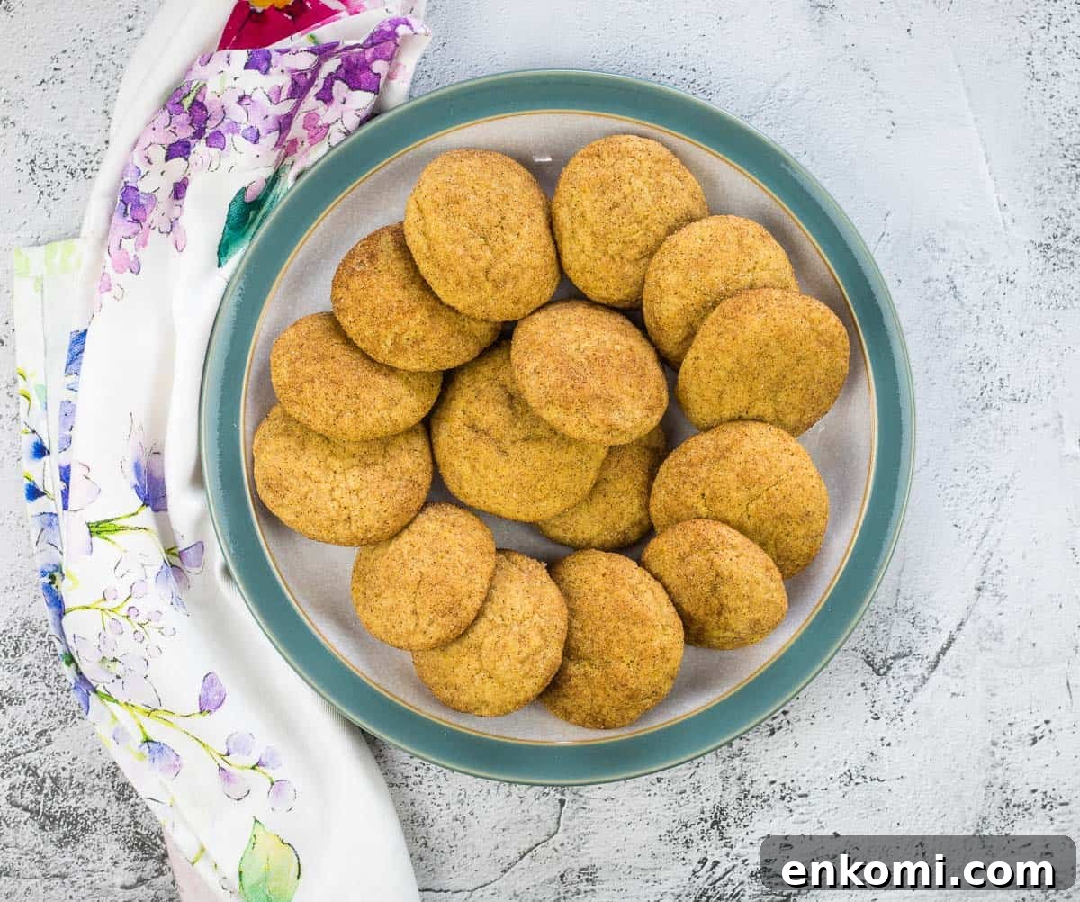 29 Fall Desserts That Bring Generations of Flavor Together 27 Pumpkin Snickerdoodles on a circle grey and blue plate.