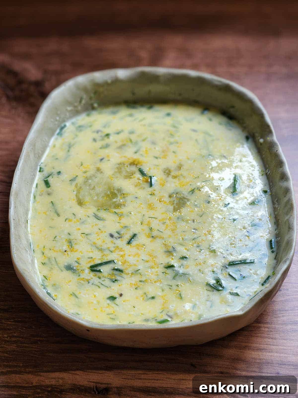 Parmesan, Lemon & Herb Savory French Toast Recipe 5 Mixed French toast custard in a rectangle dish.