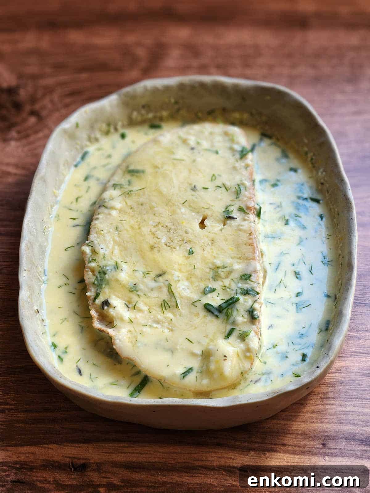 Parmesan, Lemon & Herb Savory French Toast Recipe 6 Bread dipped in French toast batter in rectangle dish.
