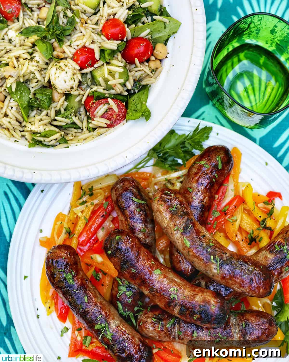 bowl of orzo pesto salad, bowl of grilled bratwurst